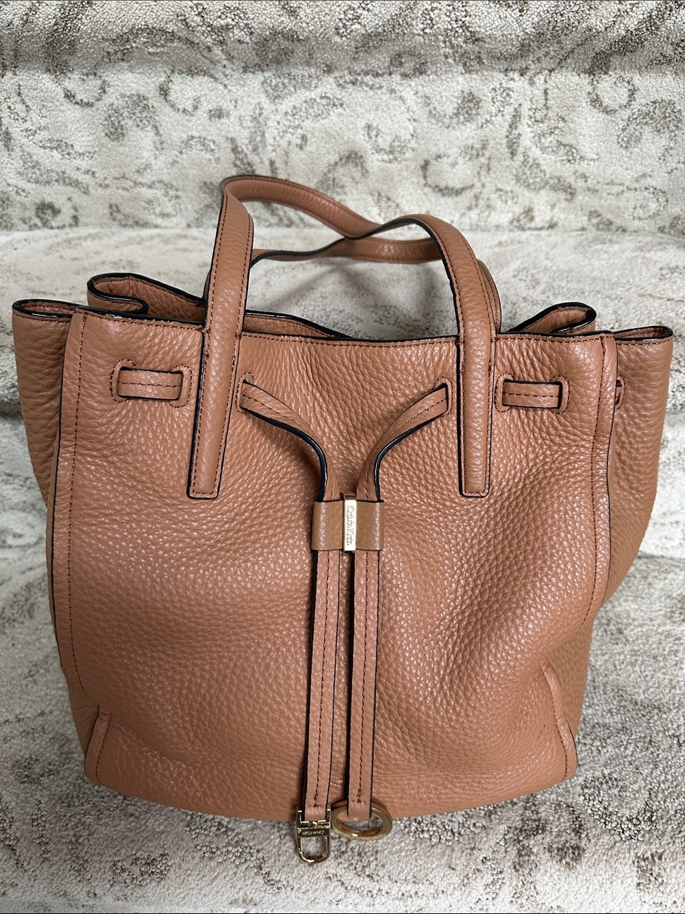 Calvin Klein Pebbled Leather Drawstring Tote in Tan